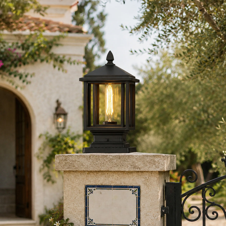 Modern black outdoor gate light styled on entrance pillar for elegant luxury exterior decor ambiance.