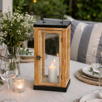 Lifestyle image of medium brown wooden lantern for rustic patio decor styling and modern outdoor home patio lighting.