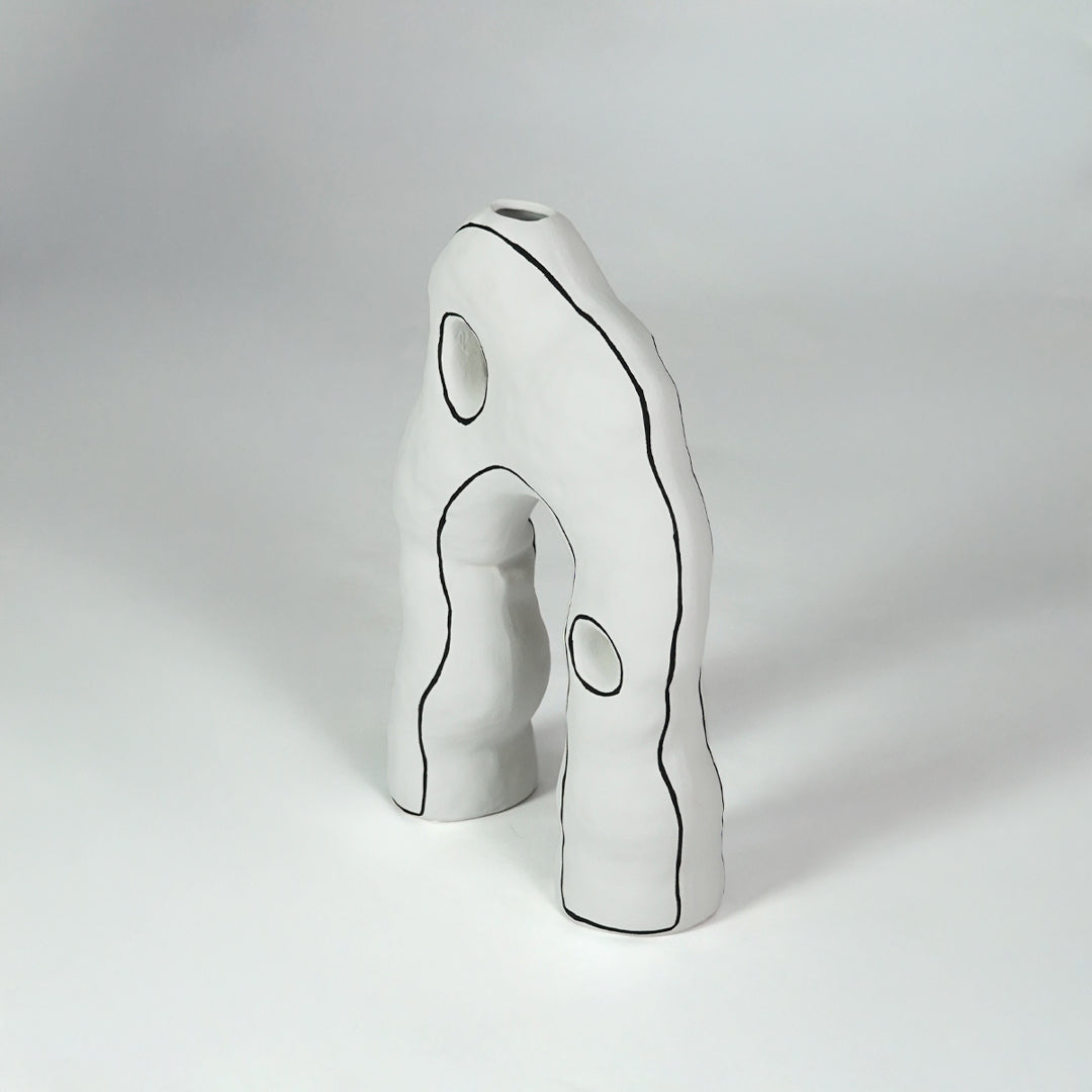White sculptural ceramic decor object for stylish console table placement and contemporary indoor decor styling.