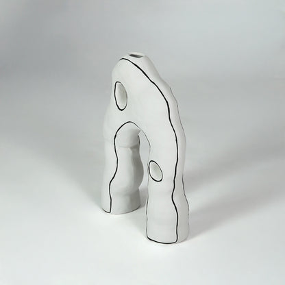 White sculptural ceramic decor object for stylish console table placement and contemporary indoor decor styling.