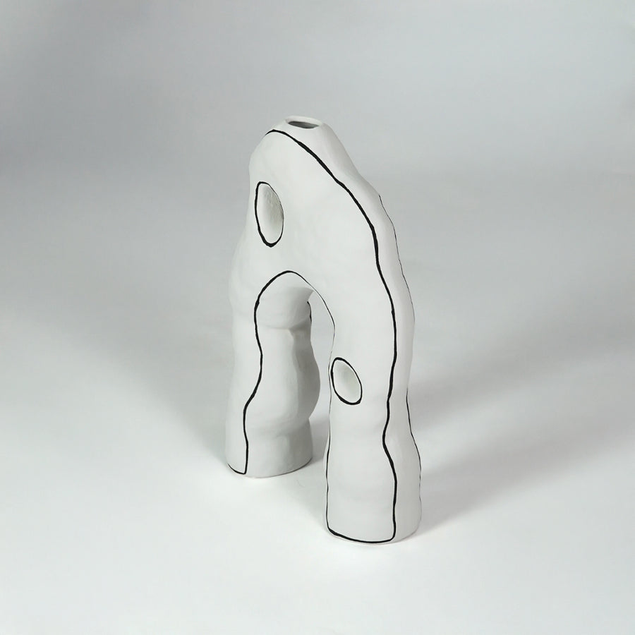 White sculptural ceramic decor object for stylish console table placement and contemporary indoor decor styling.