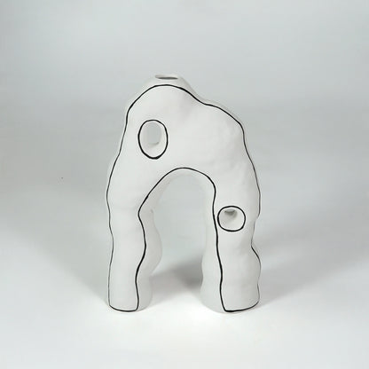 White abstract ceramic decor sculpture for modern shelf placement and artistic indoor home decor styling accent.