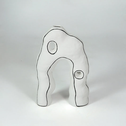 White abstract ceramic decor sculpture for modern shelf placement and artistic indoor home decor styling accent.