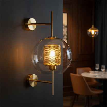 Luxury gold metal wall light with textured glass shade for premium living room and elegant decor spaces.

