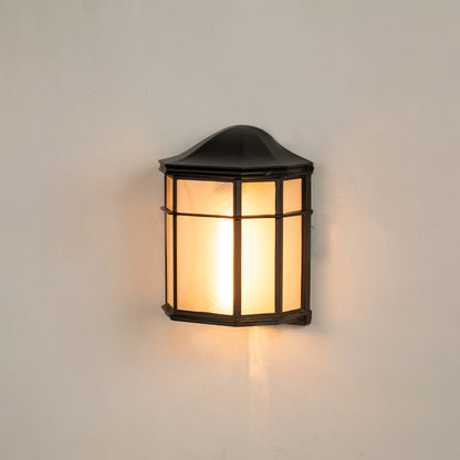 Black aluminum outdoor wall light on white background with a frosted glass panel lattice guard shade for patio decor.