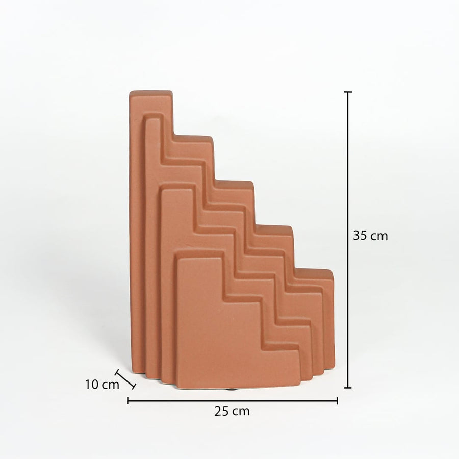 Orange ceramic stepped decorative sculpture measuring 35 cm height 25 cm width and 10 cm depth for modern shelf decor styling.