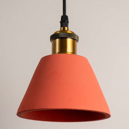 Terracotta cone pendant light featuring a sleek conical shade and brass holder displayed with the light turned off.