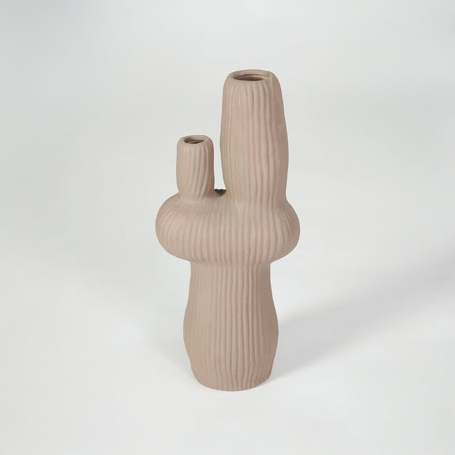Beige ribbed ceramic vase for modern shelf placement and elegant indoor home decor styling accent piece.