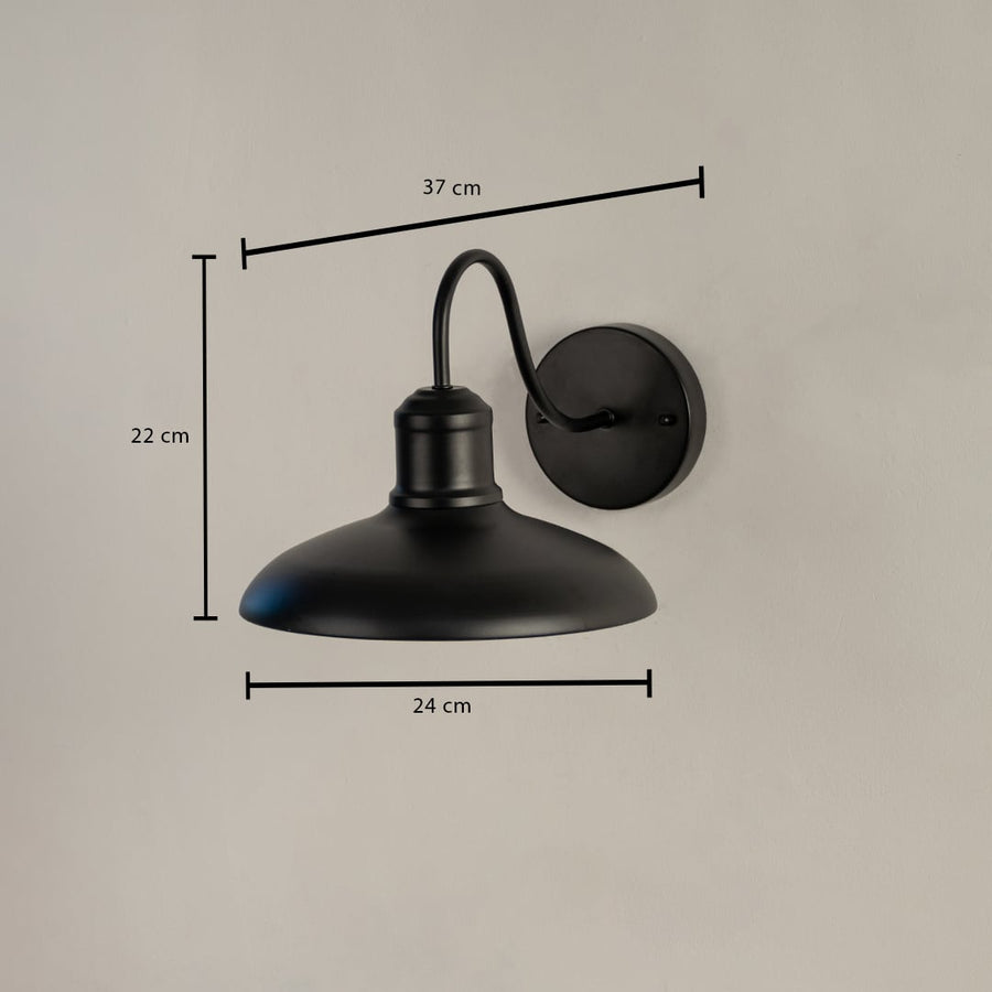 Matte black outdoor wall light with curved arm shown with 22 cm height 24 cm shade width and 37 cm projection for accurate outdoor fitting.