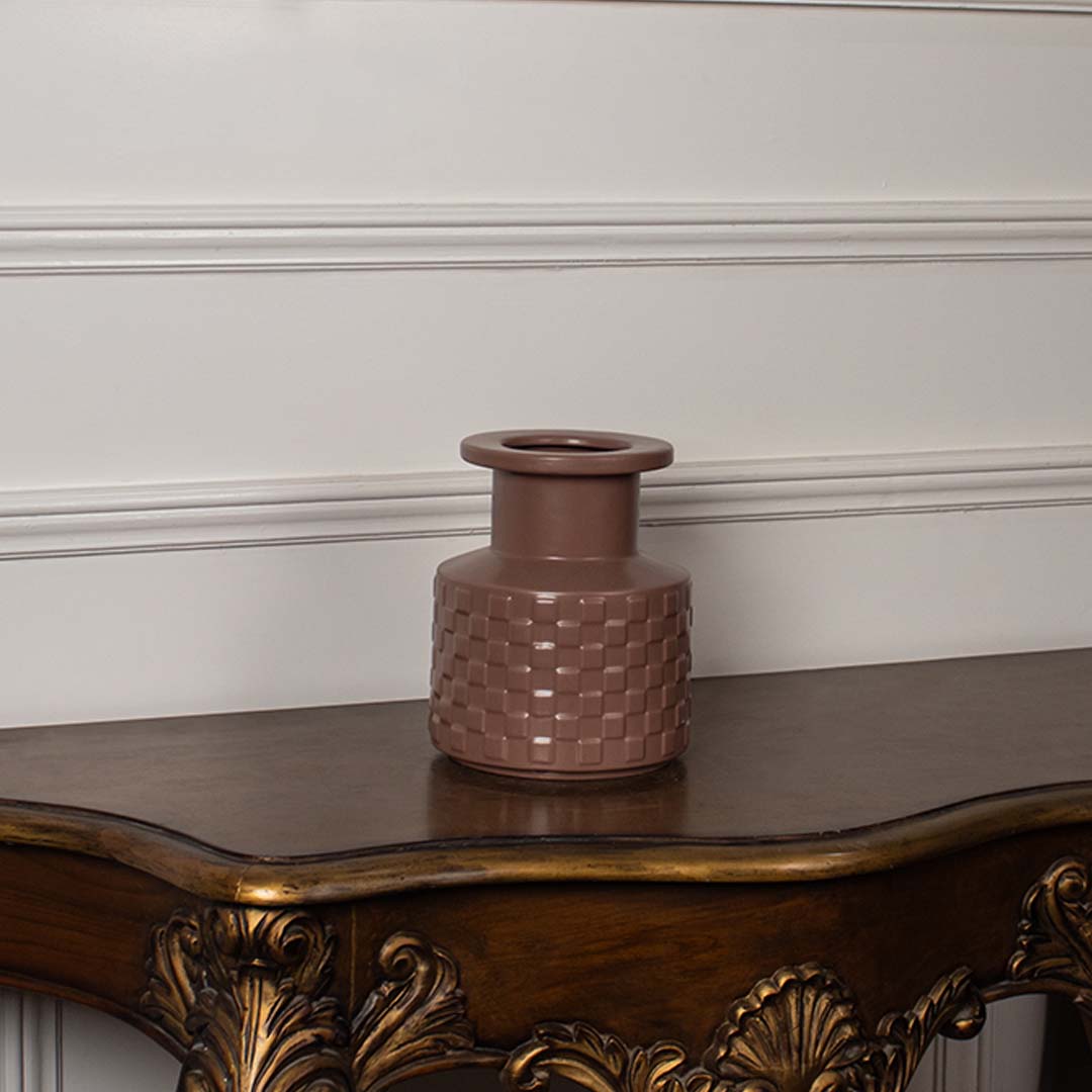Terracotta textured ceramic vase with matte finish displayed on white background perfect for modern home styling.