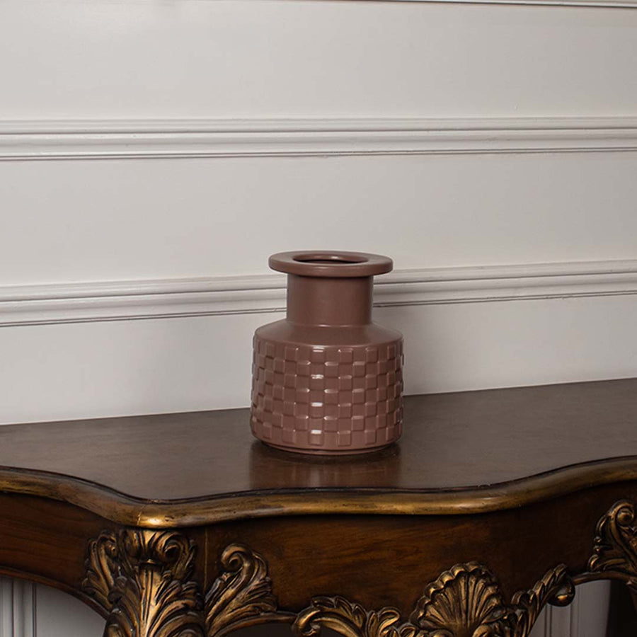 Terracotta textured ceramic vase with matte finish displayed on white background perfect for modern home styling.