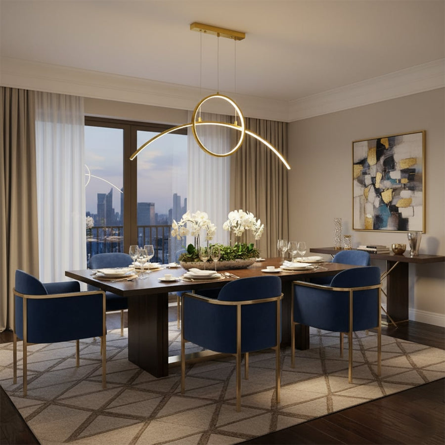 Gold ring LED chandelier suspended above formal dining table with blue chairs and floral centerpiece creating a refined modern dining room ambiance.