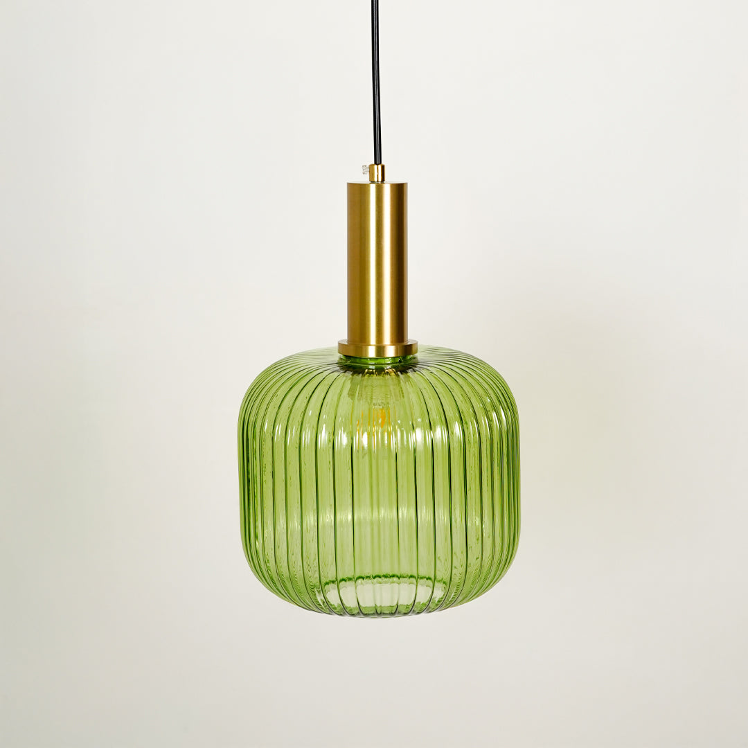 Green ribbed glass pendant light with brass finish on white background for elegant ceiling lighting decor style.