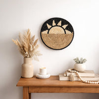 Green woven wall basket displayed above a console table for warm bohemian wall decor and stylish home interiors.