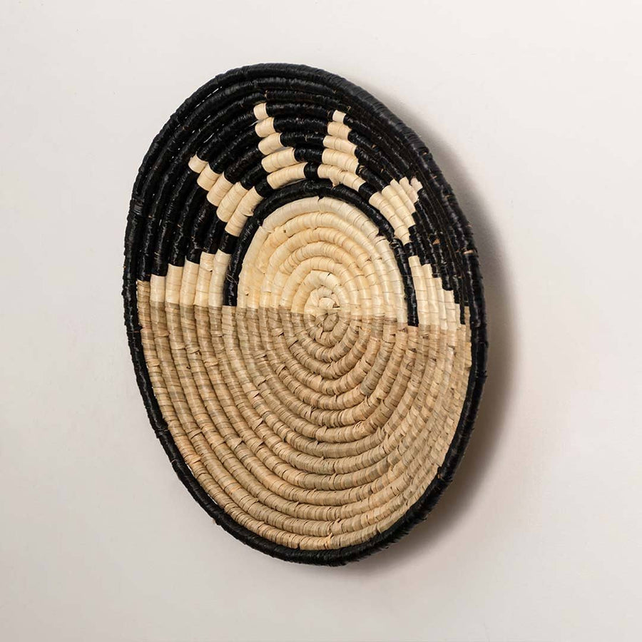 Dimension image of oval handcrafted seagrass wall basket with green leaf pattern for boho wall décor display.