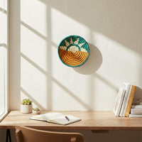 Green woven wall basket displayed beside a window for artistic bohemian wall decor and contemporary home interiors.
