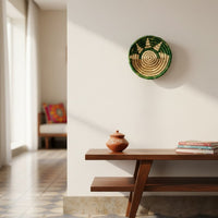 Green handwoven wall basket used as wall art in a modern minimalistic living room setting.