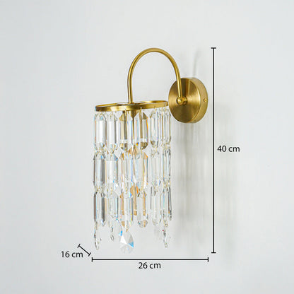 Gold wall light with crystal glass drops mounted on neutral wall background 40 cm height 26 cm width 16 cm depth perfect for luxury interior lighting.

