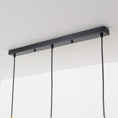 Closeup showing smooth metallic finish and dome shape of modern gold white and chrome hanging light.
