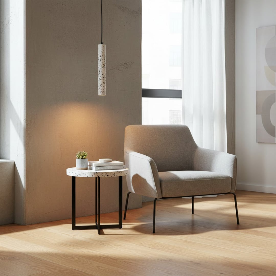 White terrazzo pendant light with black flecks adding warm elegance to contemporary living rooms.