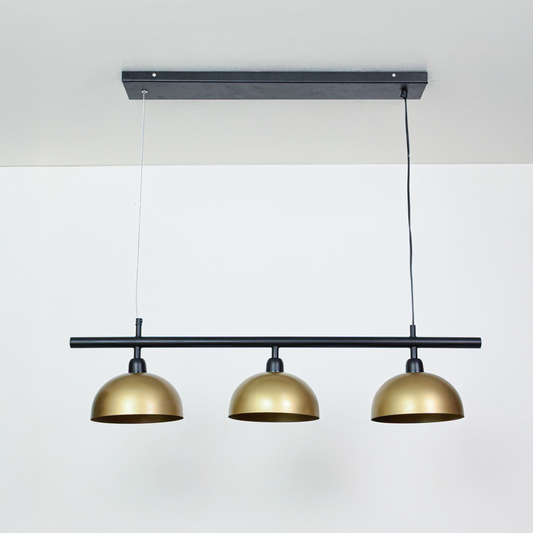 Three light black and gold metal pendant fixture designed for modern dining room decor spaces.
