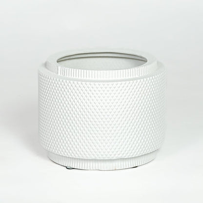 White ceramic planter with textured woven pattern and round shape isolated on white background for modern home decor use.