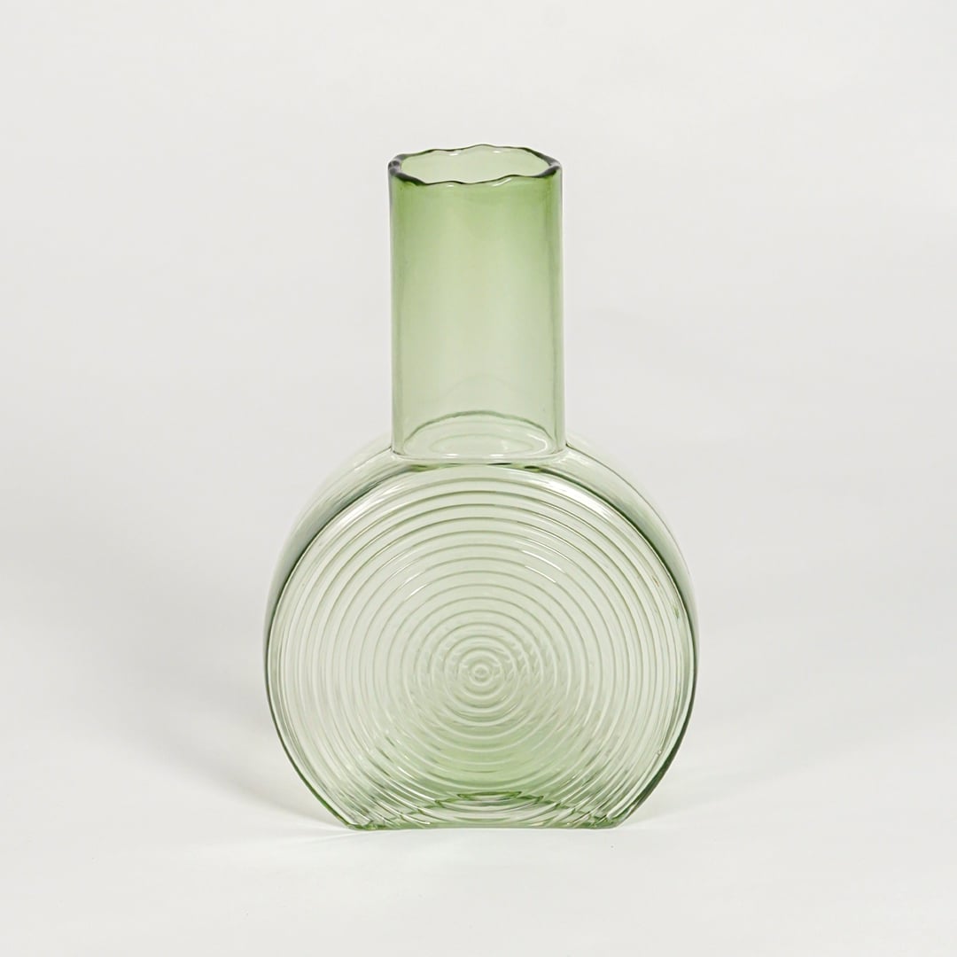 round geometric shape glass vase green white background