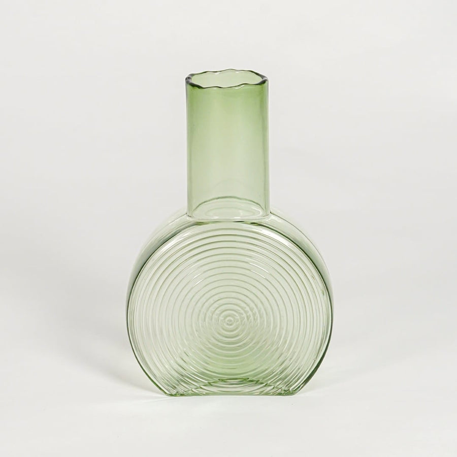 round geometric shape glass vase green white background