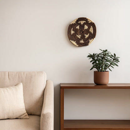 Decorative round wall basket styled above console with plant and sofa creating warm modern living room Decor atmosphere.