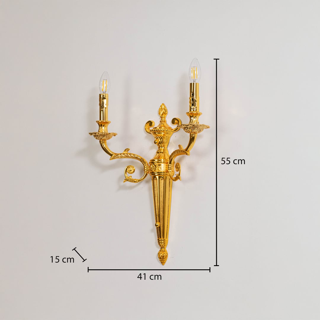 Golden wall light with candle style design dimensions 55cm height 41cm width 15cm depth displayed on white background.