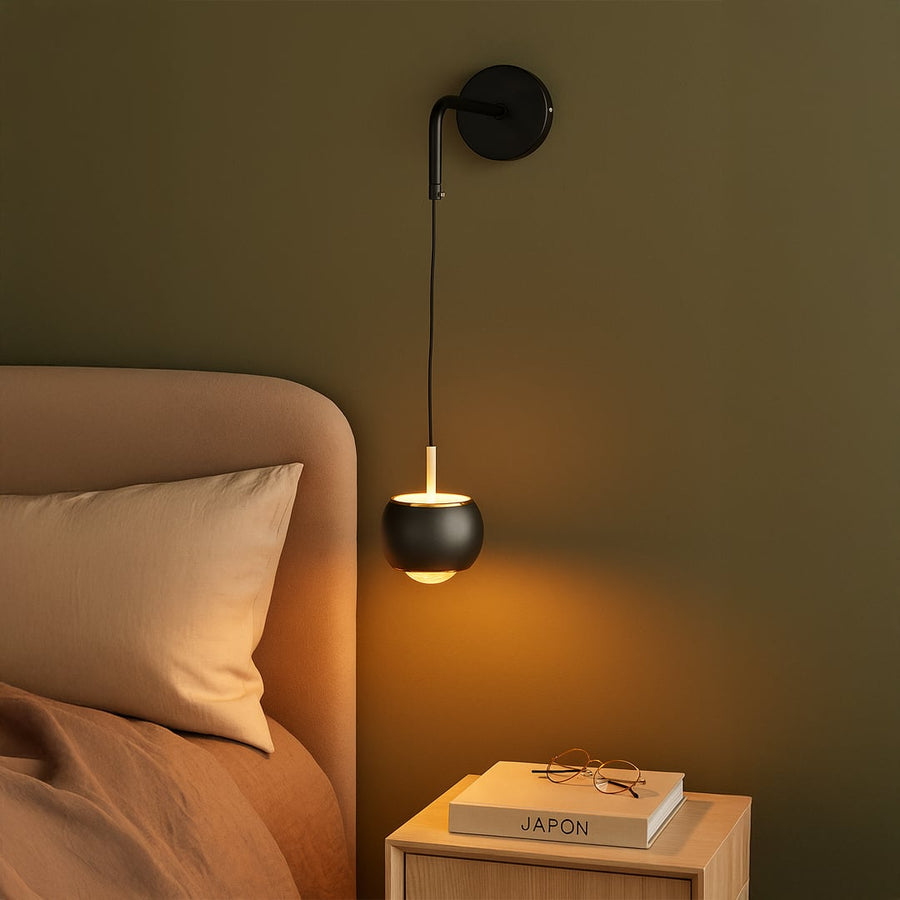Table lamp style wall light shown in a modern lifestyle setup with adjustable hanging design adding soft accent lighting to warm interior spaces.