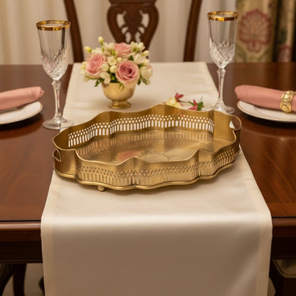 Luxury gold metal serving tray lifestyle image with floral centerpiece for elegant classic dining table decor.