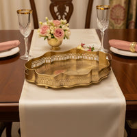Luxury gold metal serving tray lifestyle image with floral centerpiece for elegant classic dining table decor.