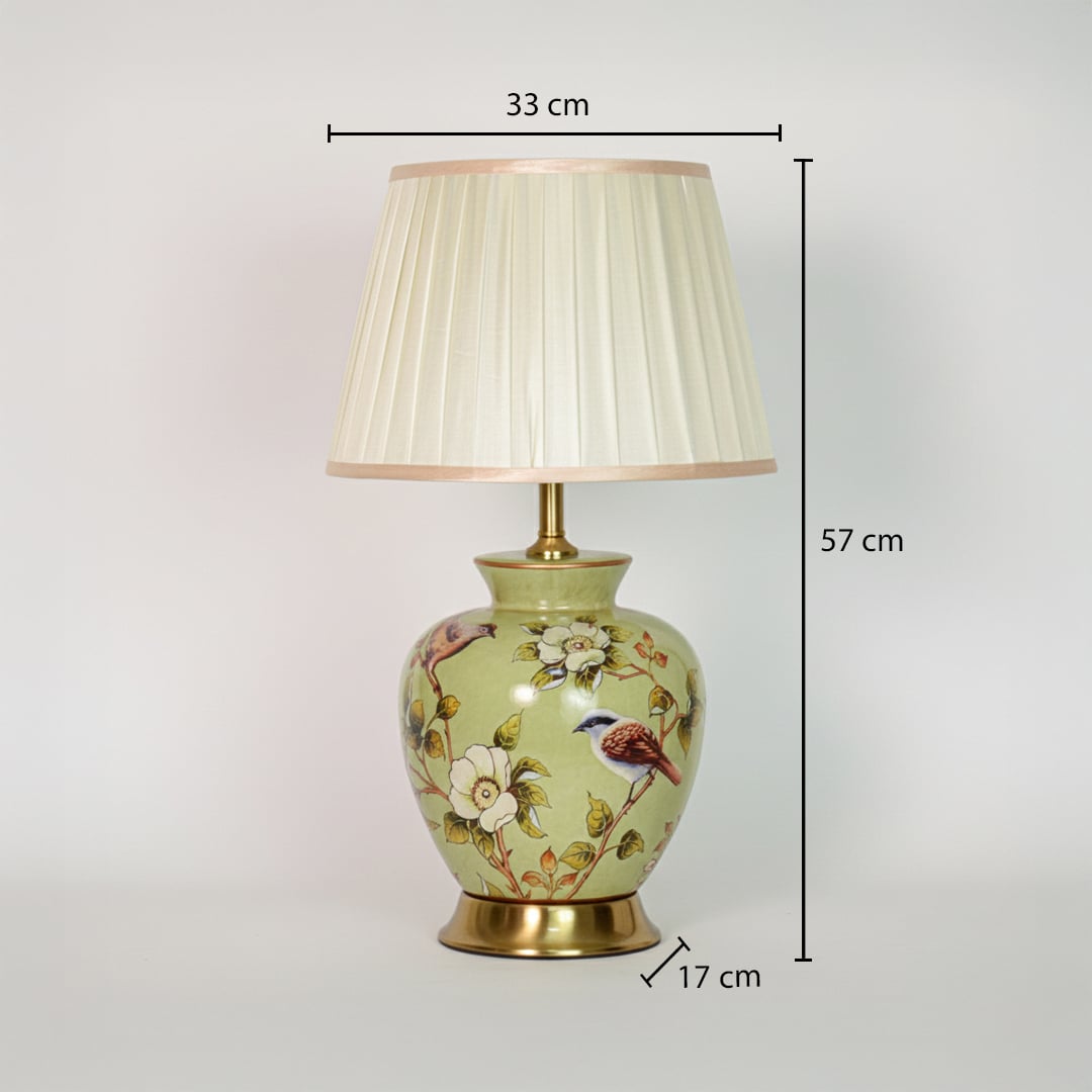 Green ceramic table lamp showing 57 cm height 33 cm shade width and 17 cm base size ideal for bedside placement.