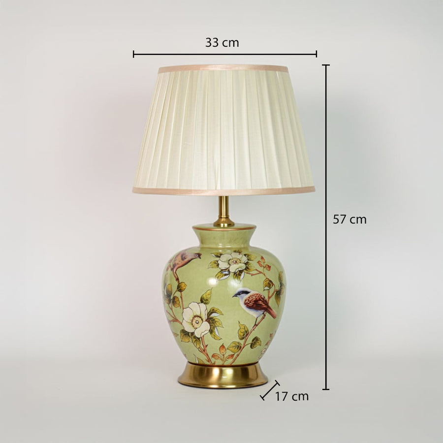 Green ceramic table lamp showing 57 cm height 33 cm shade width and 17 cm base size ideal for bedside placement.