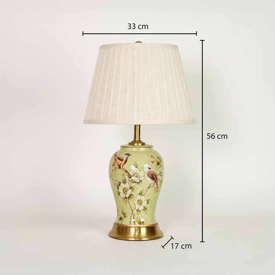 Green ceramic table lamp showing 56 cm height 33 cm shade width and 17 cm base size ideal for bedside placement.