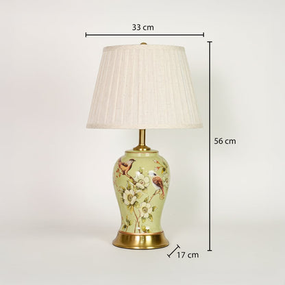 Green ceramic table lamp showing 56 cm height 33 cm shade width and 17 cm base size ideal for bedside placement.