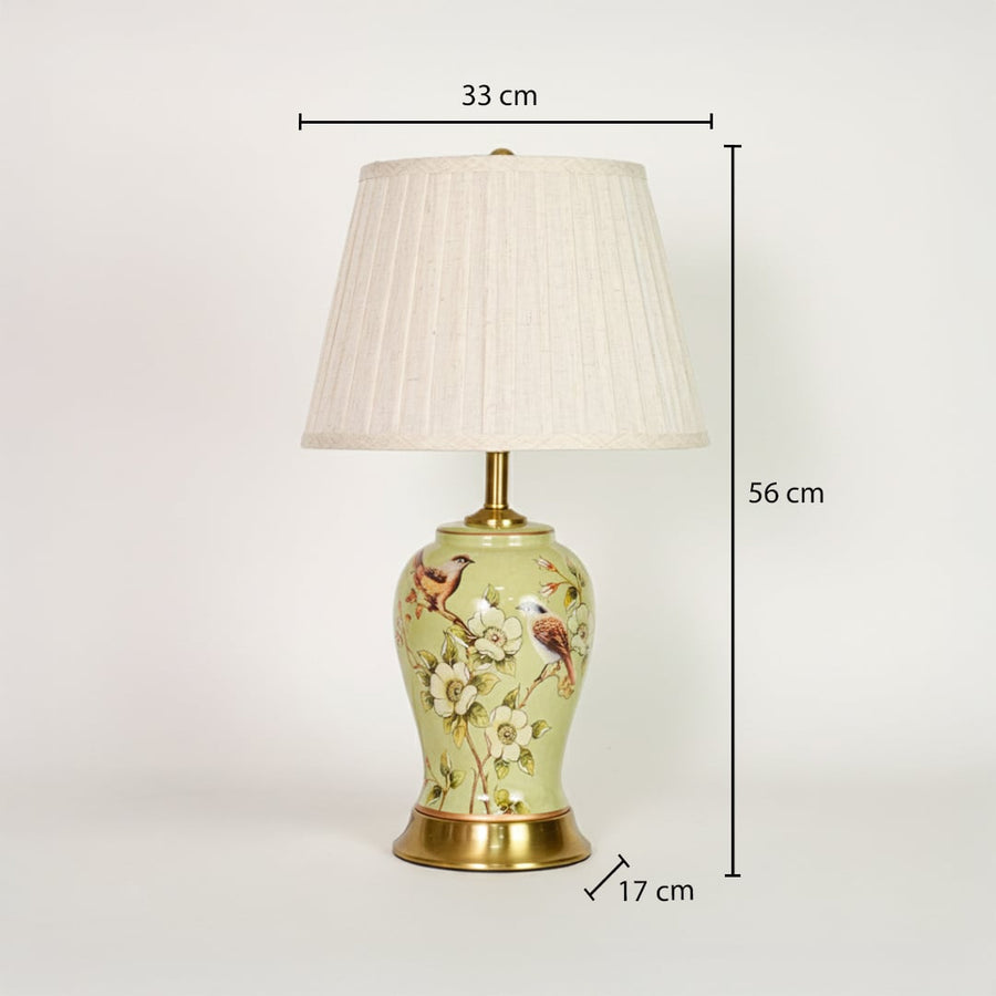 Green ceramic table lamp showing 56 cm height 33 cm shade width and 17 cm base size ideal for bedside placement.