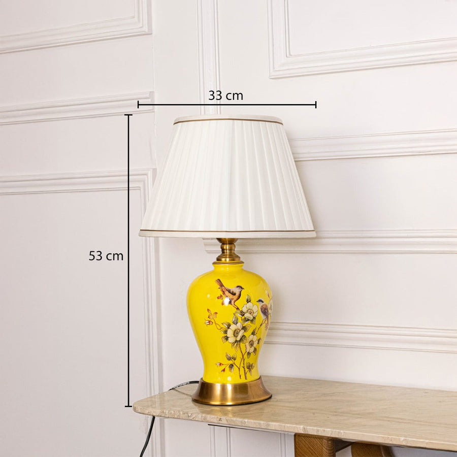 Table lamp with yellow ceramic base and white pleated shade shown with 33 cm width and 53 cm height for accurate decor placement.