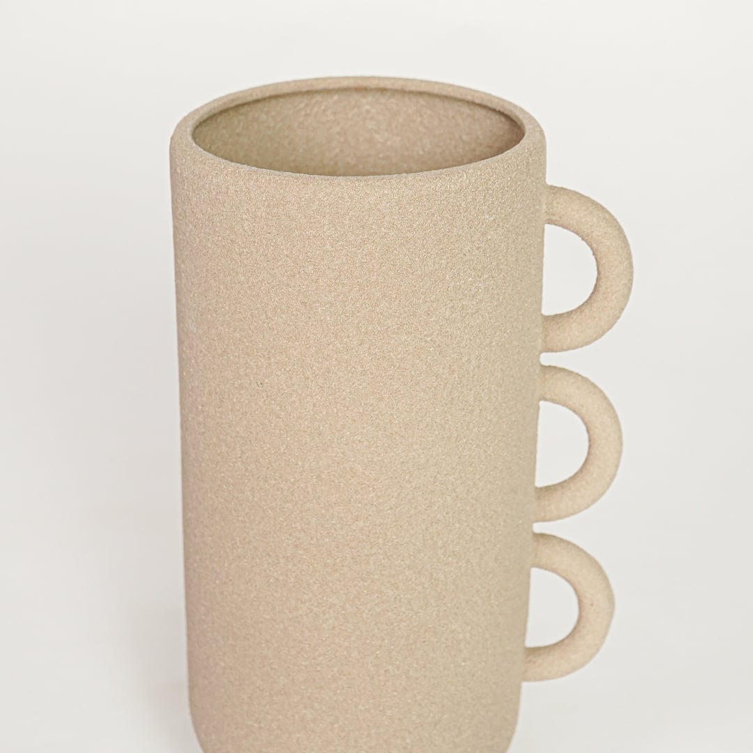Beige ceramic decorative vase with textured surface and triple handle design perfect for elegant dried floral display and interior decor.
