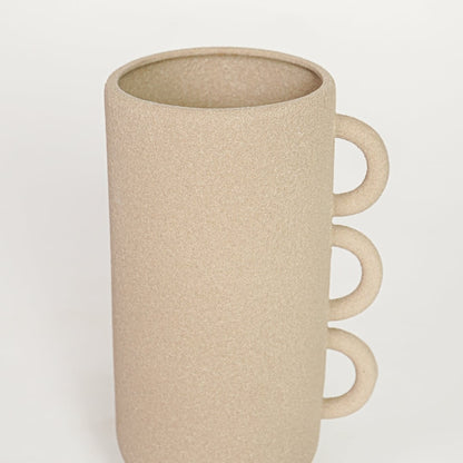 Beige ceramic decorative vase with textured surface and triple handle design perfect for elegant dried floral display and interior decor.
