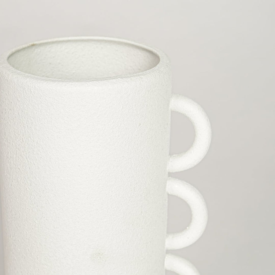 White ceramic decorative vase with textured matte surface and triple handle design perfect for elegant dried floral display.