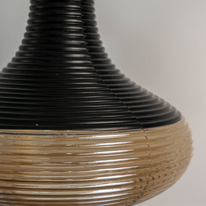 Closeup of glossy red pendant lamp showing golden holder and smooth curved glass for premium modern decor.