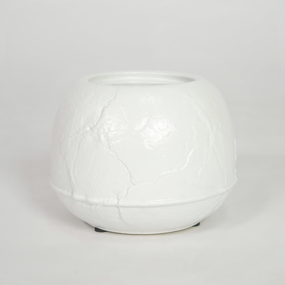 White textured ceramic planter pot for elegant coffee table placement and minimalist indoor home decor styling accent.