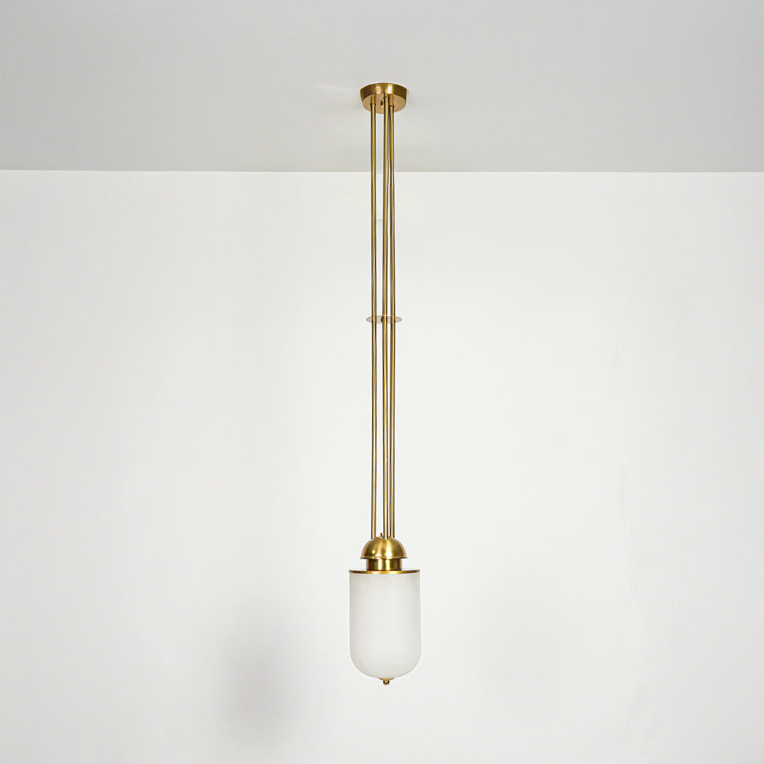 Gold metal and white glass pendant light designed for elegant dining room and living spaces.