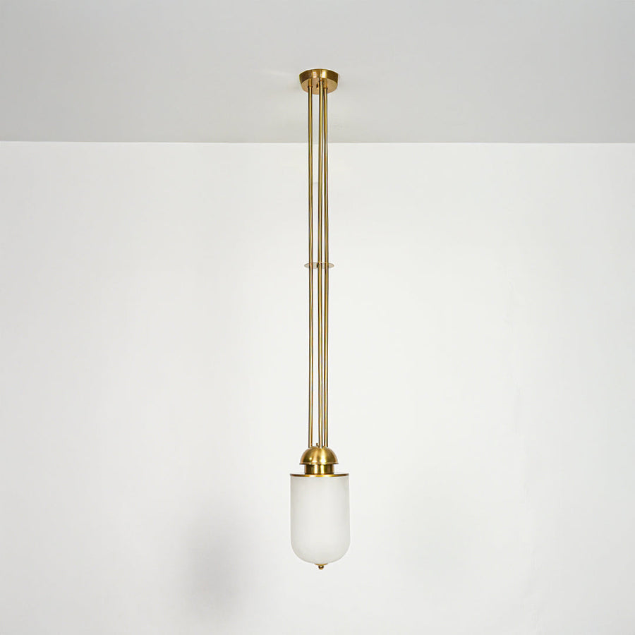 Gold metal and white glass pendant light designed for elegant dining room and living spaces.