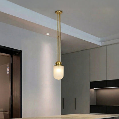 Black metal and white glass pendant light adding warm elegance to modern kitchen interiors.