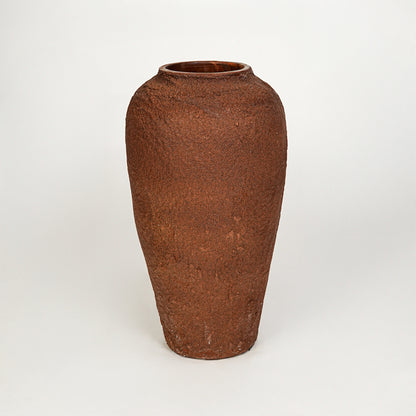 White background image of terracotta ceramic decorative vase for rustic floor placement with textured finish.
