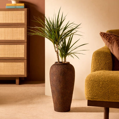 Brown ceramic floor planter with textured matte finish styled with greenery for elegant modern home decor.