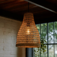 Handwoven brown rattan pendant light creating warm ambient lighting with rustic charm for cozy interiors.